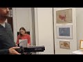 My daughter Sarah playing piano at her art exhibition.