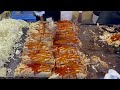 japanese street food - busy okonomiyaki stall お好み焼き