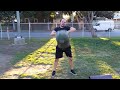 Matt squat lifting a 60lb sandbag