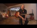 Mark Knopfler Showing his magic on an acoustic guitar