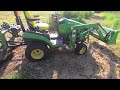 John Deere 1025R with 48 inch Bush Hog REVERSE in tall stuff