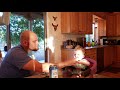 Laughing baby plays drop the pacifier with her father