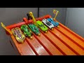 Racing older fantasy cars against new ones on the Hot Wheels track!