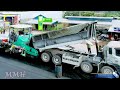 Amazing large-scale road paving operation on a highway. Several heavy machinery and asphalt trucks