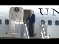 President Joe Biden climbs steps to Air Force One at HIA