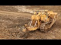 Caterpillar CAT D9G pushing and rip rock