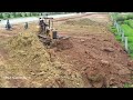 New perfect project! operator skills dozer d20p pushing soil process with dump trucks unload