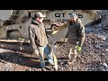 Installing a rock crusher belt and crushing rock