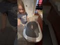 Daughter learns the “Magic” password to the new trash can.