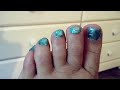 painting toe nails teal with glitter