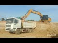 Work of dump truck and Excavator cat 320gx