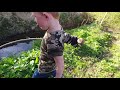 kids jump across stream