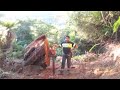 Husqvarna 3120XP cutting a big native log off an old logging track