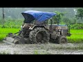 Tractors at Work in Wet and Muddy Terrain Video