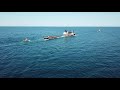 TUGBOAT BILLMAIER? towing large barge on Lake Michigan.