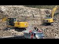 CAT Excavator Hammering Loading Hard Rock Into Dump Truck CAT 320D