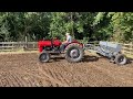 Working land and planting crops with vintage tractors