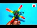 A Rainbow Spinning toy which you can easily make with ice cream sticks | A ice cream stick fan toy