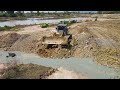 The Tensioner Work In Pond Back Fill Operation By Big Bulldozer Komatsu And Numerous Dumper Truck