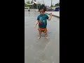 18 months old toddler gets excited about water at pool