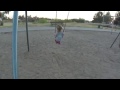 Carlee swinging at the park