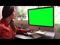 Woman Using Computer With Green Screen Display  Free stock footage  By Nelson Noman