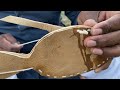 The village side worker makes a leather shoe