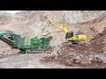 KOMATSU PC490LC feeding jaw crusher in quarry