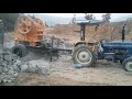 stone crusher machine operating with tractor