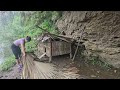 Girl builds bamboo house with thatched roof, creates protective railing - single mother