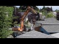 Excavator Demolishes House