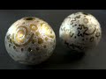Silver balls with gold inlays