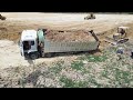 Fail Driving Dump truck and stuck in dirt and helped by Komatsu excavator / dozers filling land
