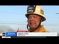 Firefighters work to extinguish two infernos in Southern California